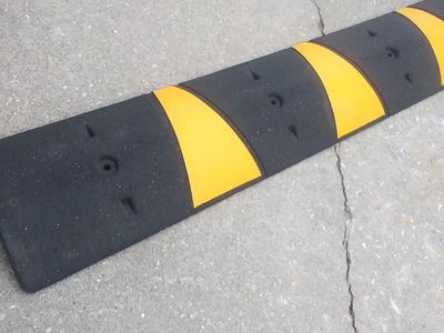 HEAVY HARD RUBBER/ASPHAULT SPEED BUMP and CABLE GUARD