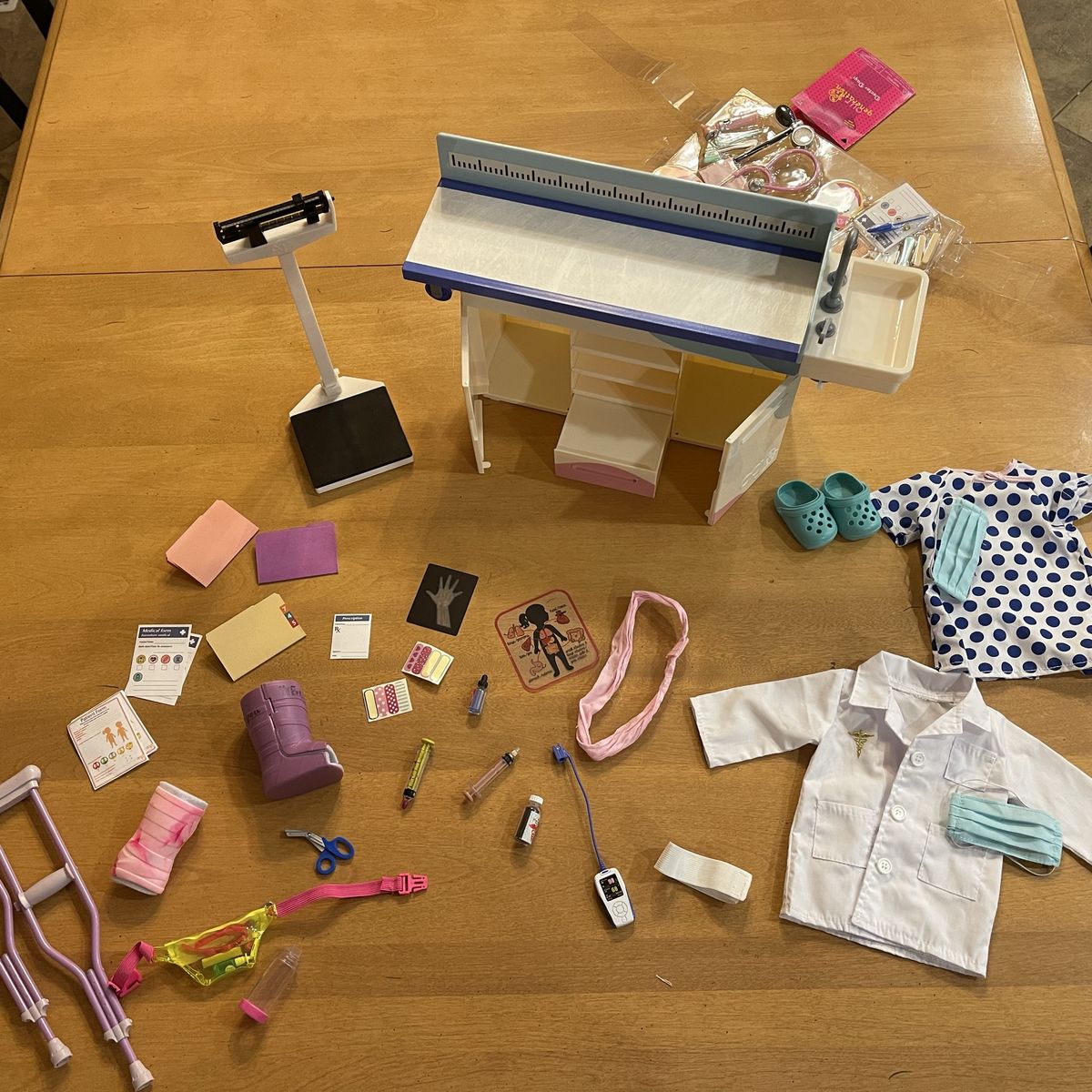 Our Generation Doctor Days Clinic Set - exam table with other medical-themed doll sets (one new)