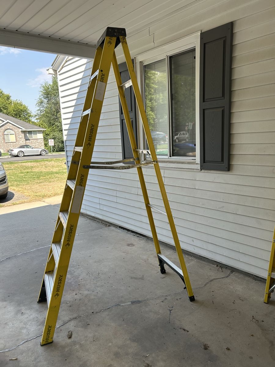 Husky 8 ft. Yellow Fiberglass Stepladder and 4 ft. Davidson Stepladder. 