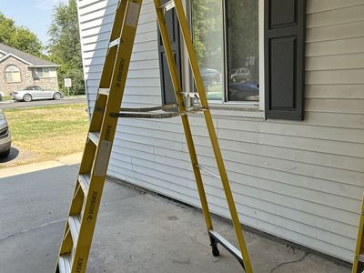 Husky 8 ft. Yellow Fiberglass Stepladder and 4 ft. Davidson Stepladder.