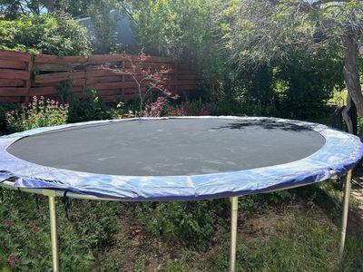 14” trampoline with unused enclosure