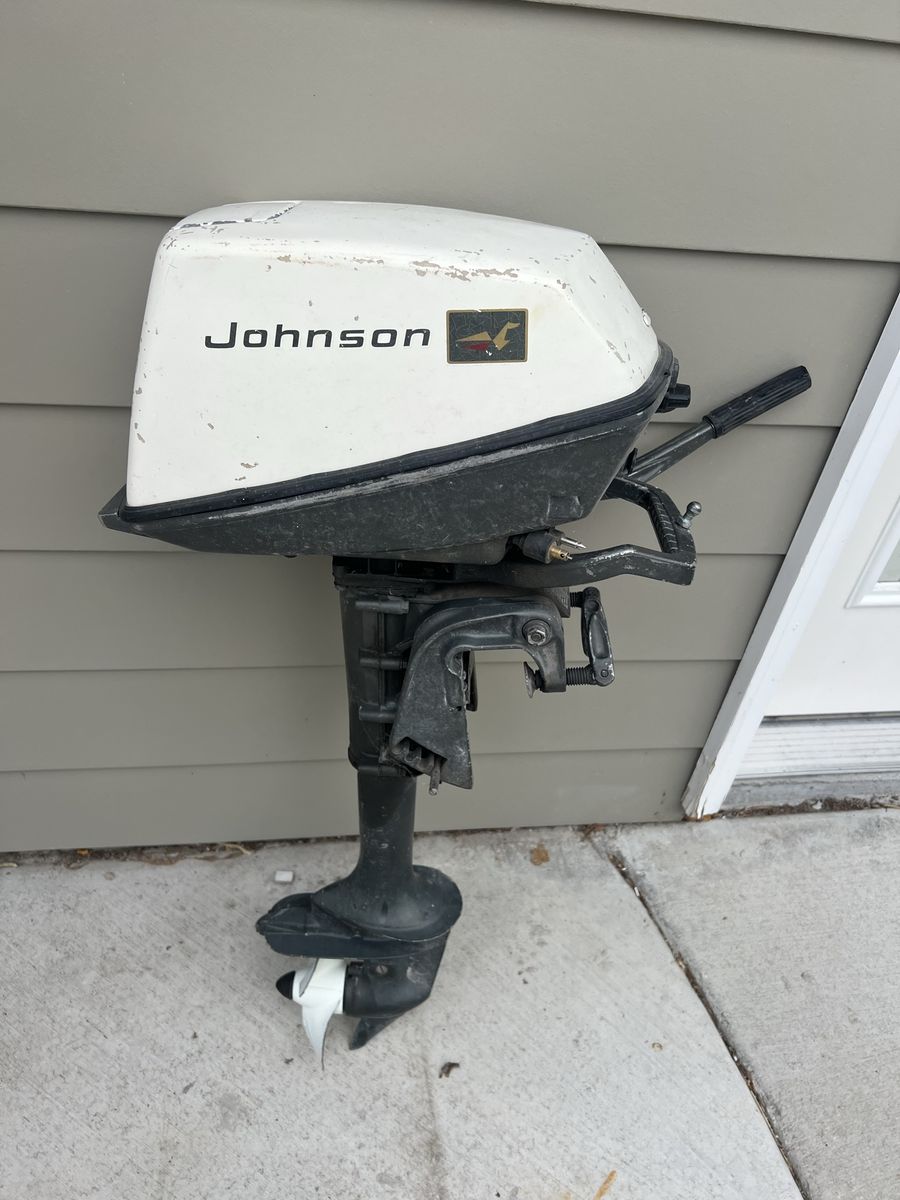 Johnson Outboard Boat Motor with Tiller Handle and Propeller