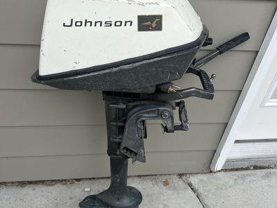 Johnson Outboard Boat Motor with Tiller Handle and Propeller