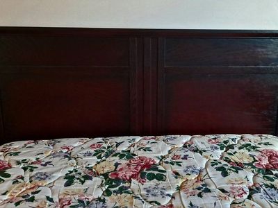 Queen size pillow top mattress & box spring with dark wood headboard