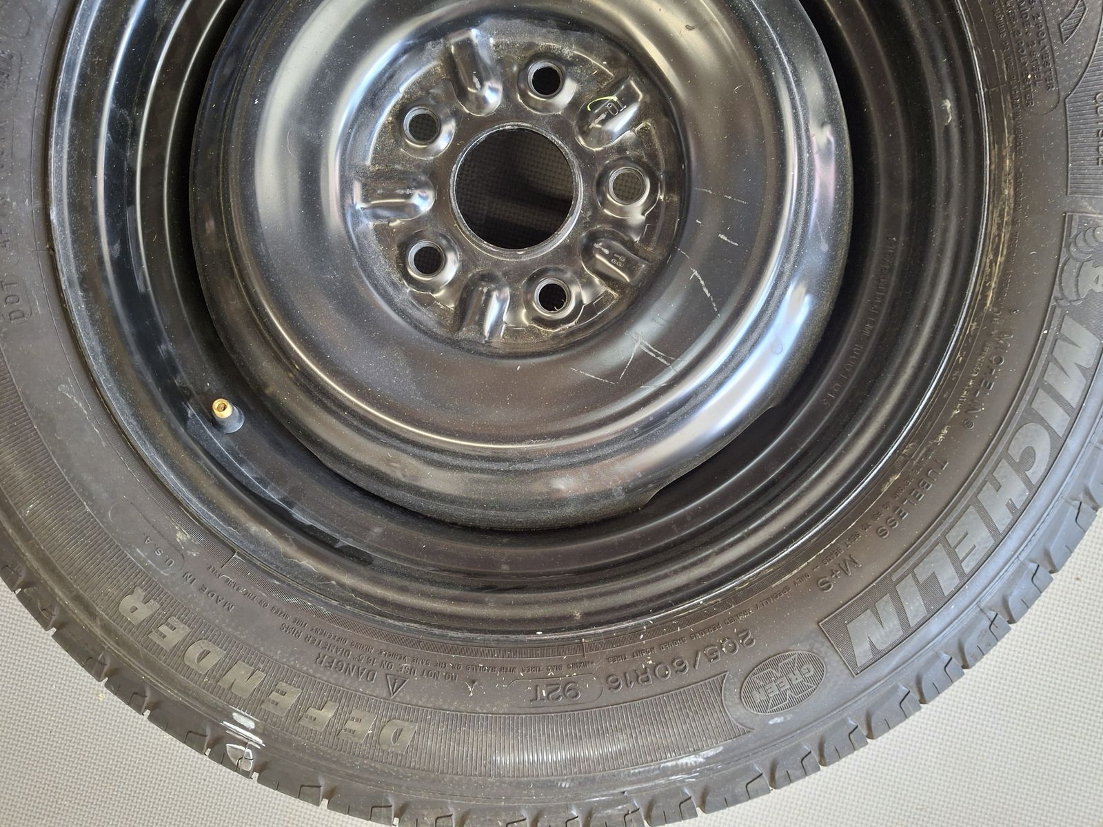 Michelin Defender 205/60R16 All-Season Tire Mounted on Black Steel Wheel