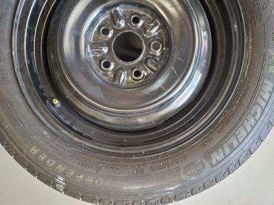 Michelin Defender 205/60R16 All-Season Tire Mounted on Black Steel Wheel