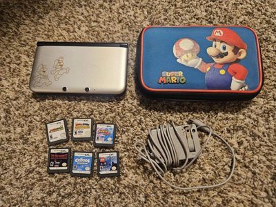 3DS XL Mario and luigi edition with 6 games, original casing and charger.