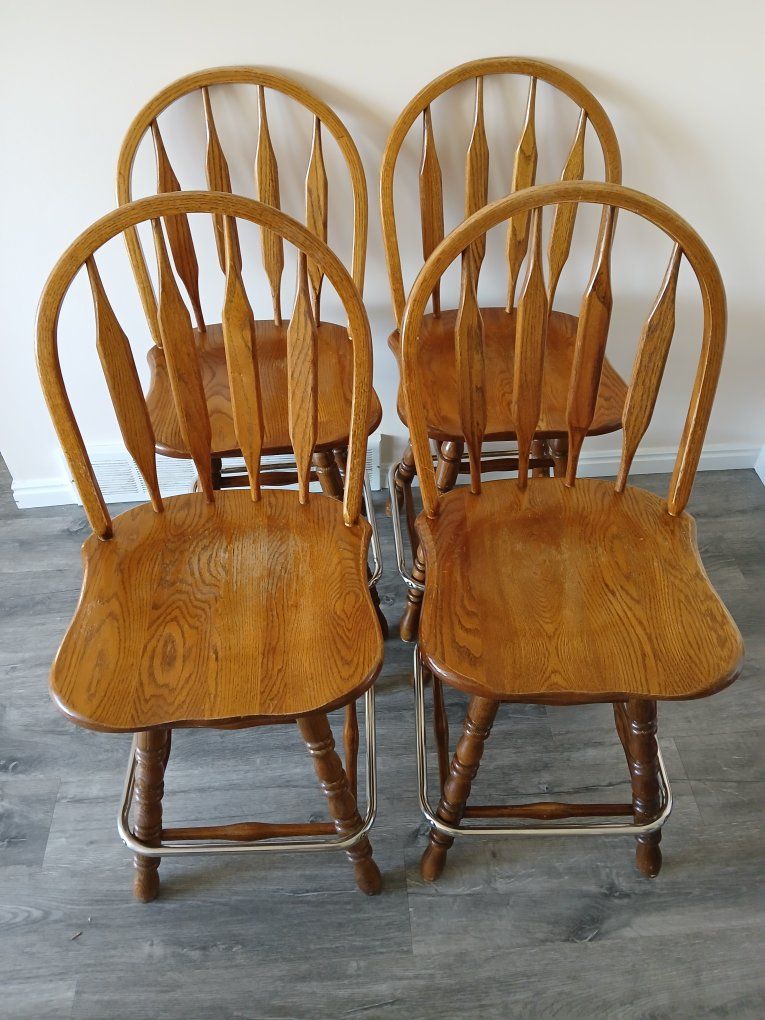4 solid oak swivel bar stools