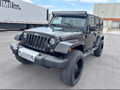 Jeep Wrangler 4-Door Hardtop with Lift Kit & Aftermarket Stereo