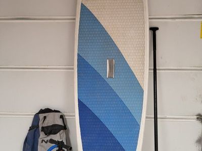 NRS Jester Inflatable Stand-Up Paddleboard (SUP) with Pump & Paddle, repair kit, leash,and pack to put it all in.