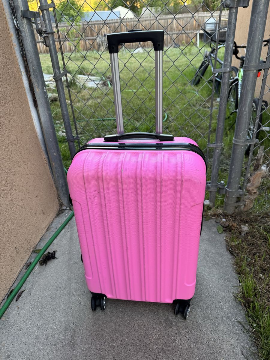Pink hard sheel luggage 24 inches Tall