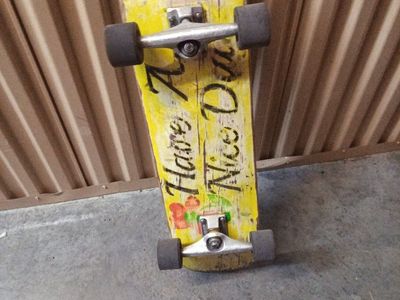 Used Skateboard with 'Have A Nice Day' Graphic - Yellow Deck, Silver Trucks, Black Wheels