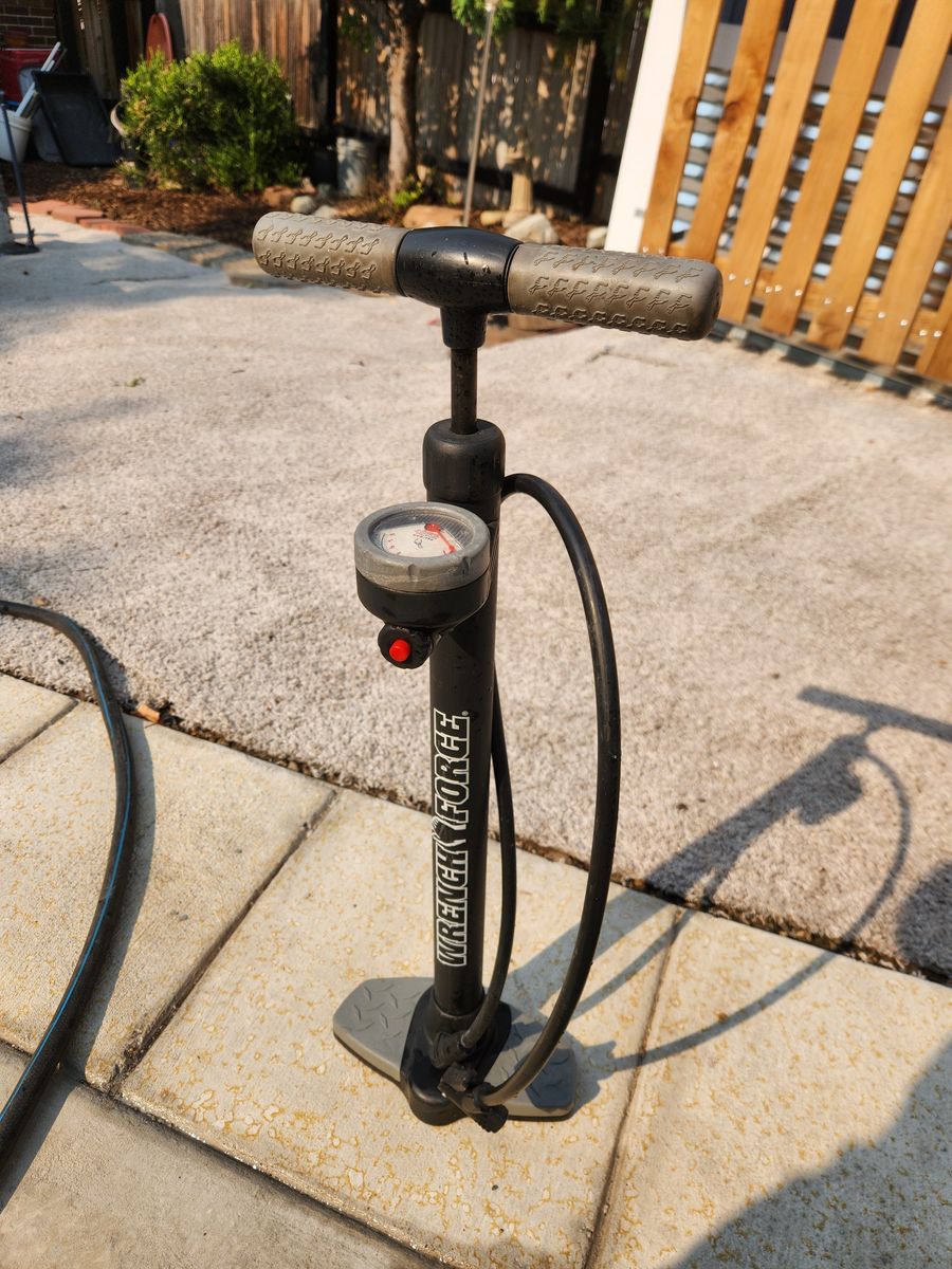 Bike pump with pressure gauge, has both Presta and Shrader fittings.  Works great.