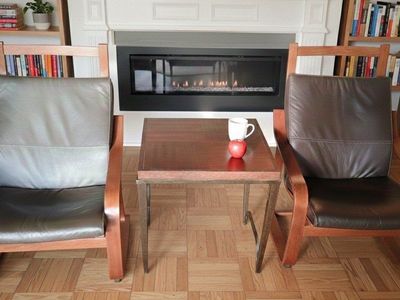 IKEA Poäng chairs with leather cushion.