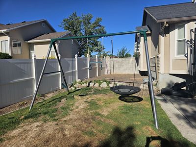 Swing set with trapeze