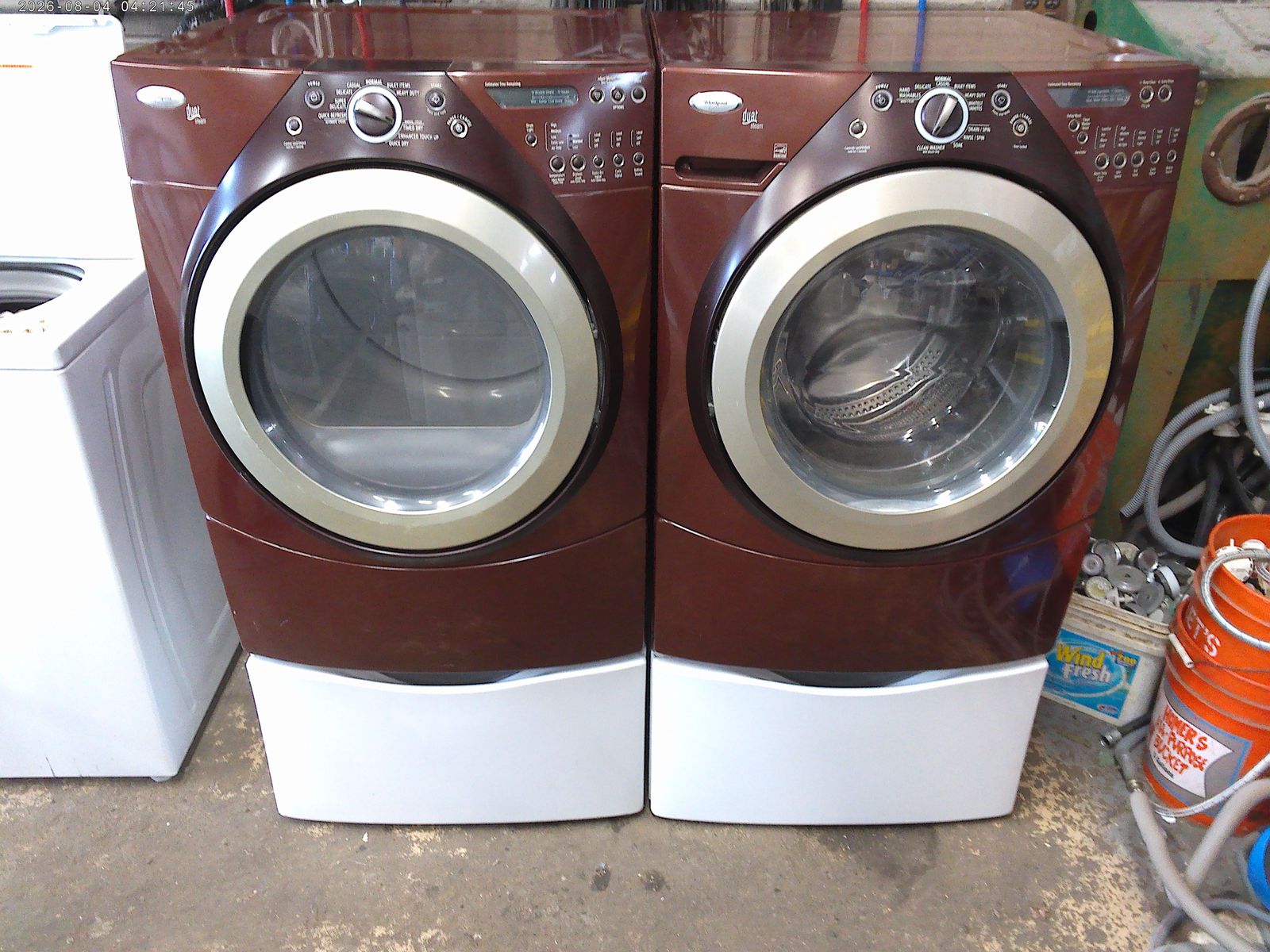 Whirlpool Duet front load washer with matched electric dryer on mismatched pedestals