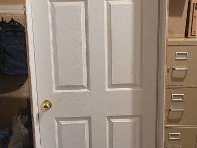 6-Panel Wooden Door with Brass Knob and Paneled Trim