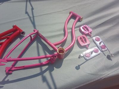 Custom painted vintage girls lowrider Schwinn frame with matching pedals and mirror set.
