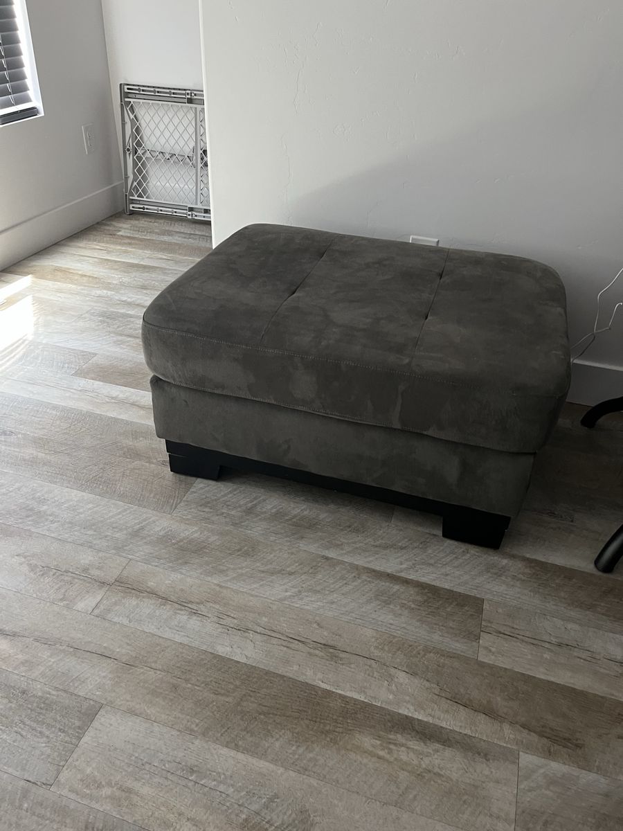 Large Gray Microfiber Upholstered Ottoman Footstool with Dark Wood Feet