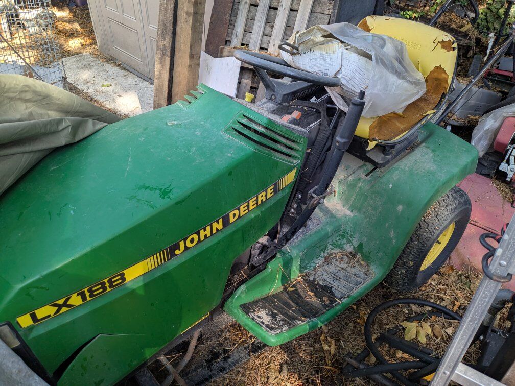 John Deere tractor snow plow bagger riding mower