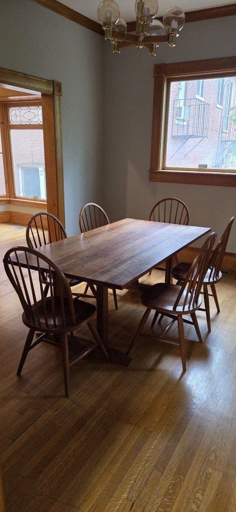 wood dining table with stickley chairs