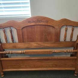 Beautiful queen-size wood bed frame with rails.