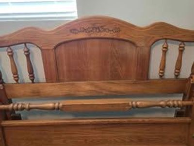 Beautiful queen-size wood bed frame with rails.