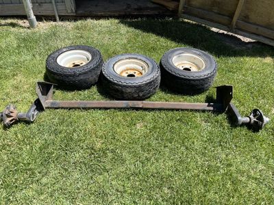2000 lbs. Torsion axel with tires, rims 120.00