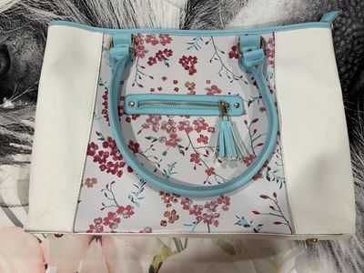 Floral Print Temple Bag Tote with Light Blue Handles and Tassel Accent
