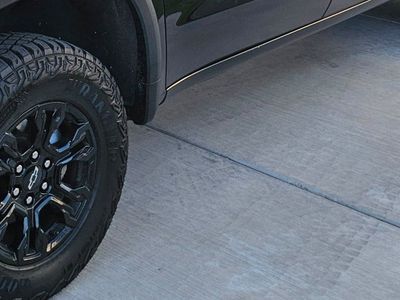 Goodyear Wrangler Territory AT LT275/70R18 All-Terrain Tires & Black Chevrolet Rims