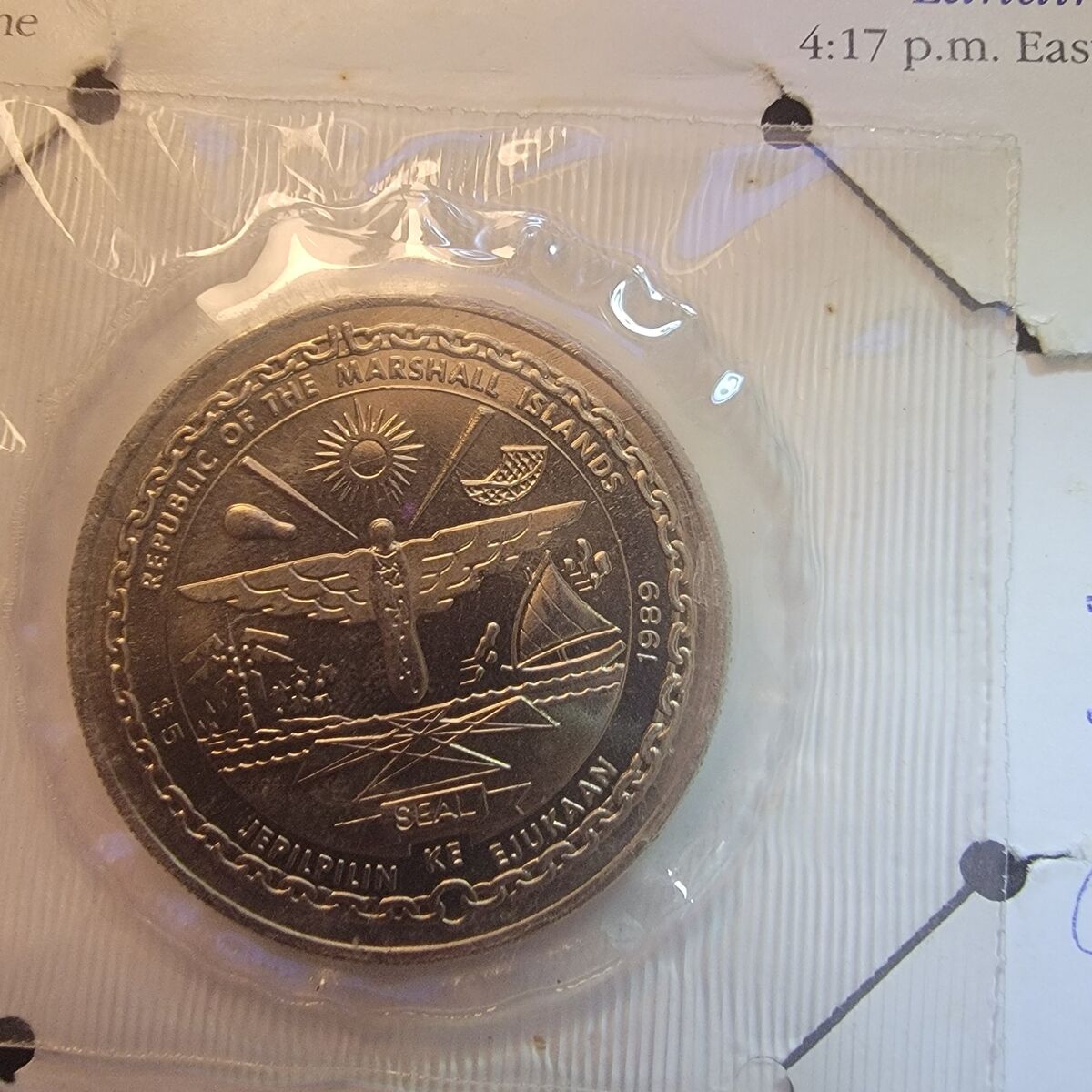 First man on the moon $,5 coin.