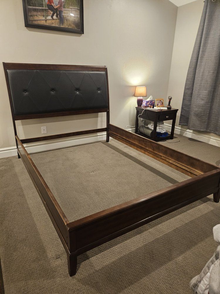 Wooden Queen Bed Frame with Tufted Faux Leather Headboard. 4 cross supports. bed was used in our guest room. 