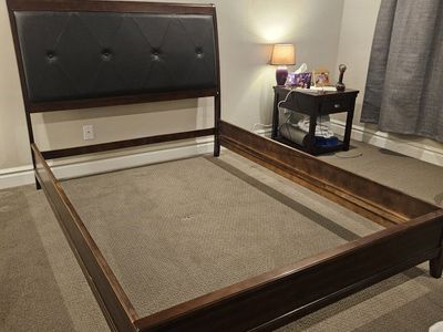 Wooden Queen Bed Frame with Tufted Faux Leather Headboard. 4 cross supports. bed was used in our guest room.