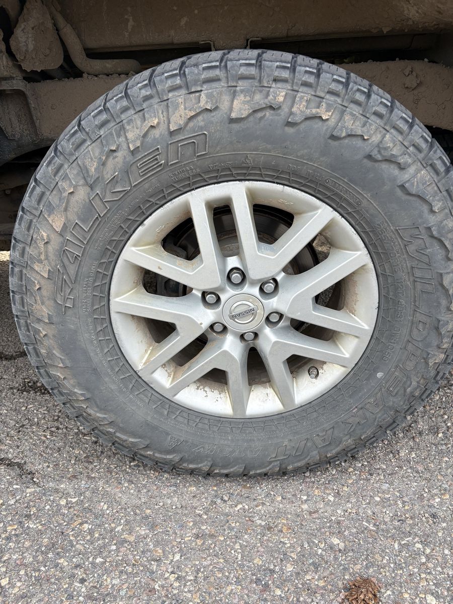 Falken Wildpeak A/T3W Tire on OEM Nissan Alloy Wheel 265/70R16 
