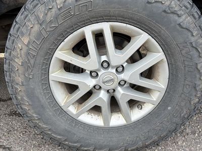 Falken Wildpeak A/T3W Tire on OEM Nissan Alloy Wheel 265/70R16