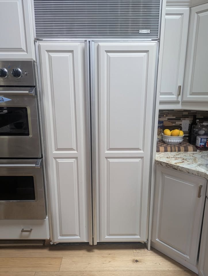 Sub-Zero Model 561 Side-by-Side Refrigerator with Custom Wood Panels