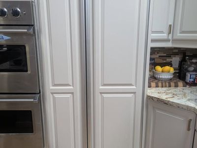 Sub-Zero Model 561 Side-by-Side Refrigerator with Custom Wood Panels