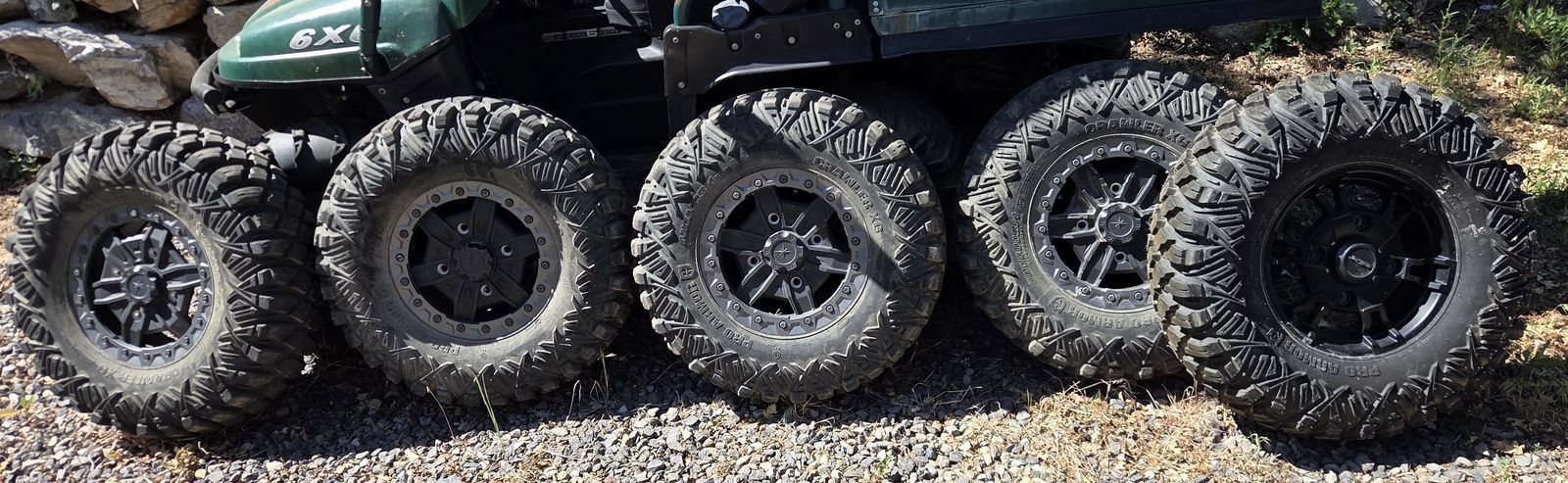 30" x 14" x 10" Pro Armor Crawler XT tires on beadlock 14 x 7 wheels for sale.