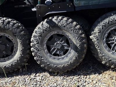 30" x 14" x 10" Pro Armor Crawler XT tires on beadlock 14 x 7 wheels for sale.