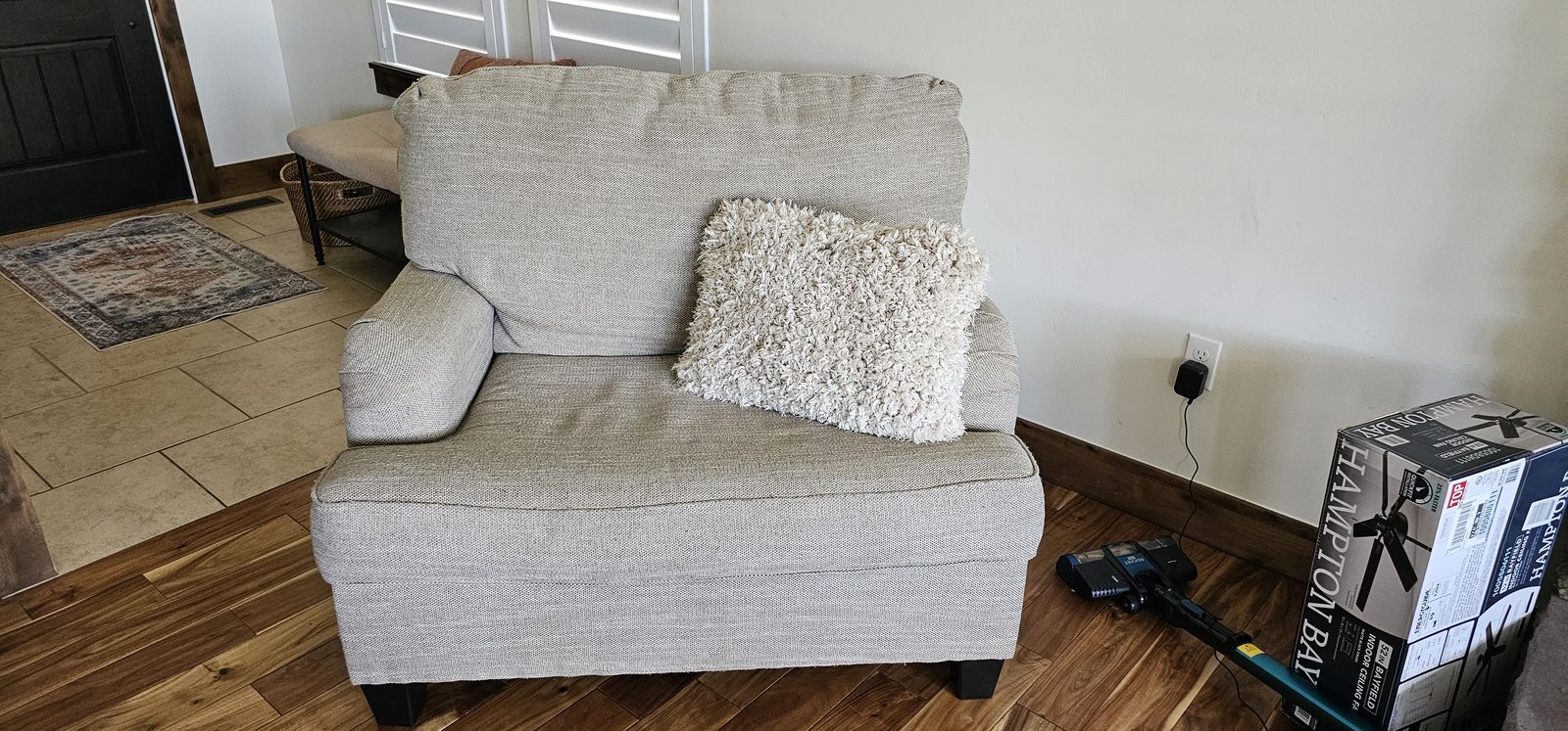 Large stuffed chair will seat a friendly couple
