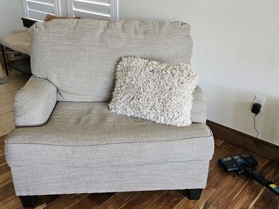 Large stuffed chair will seat a friendly couple