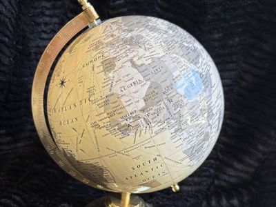 6” decorative desktop world globe with brass-tone stand and world time dial. $25 cash/venmo