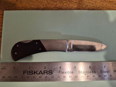 Selling a used KA-BAR lock blade pocketknife with a stainless-steel blade.