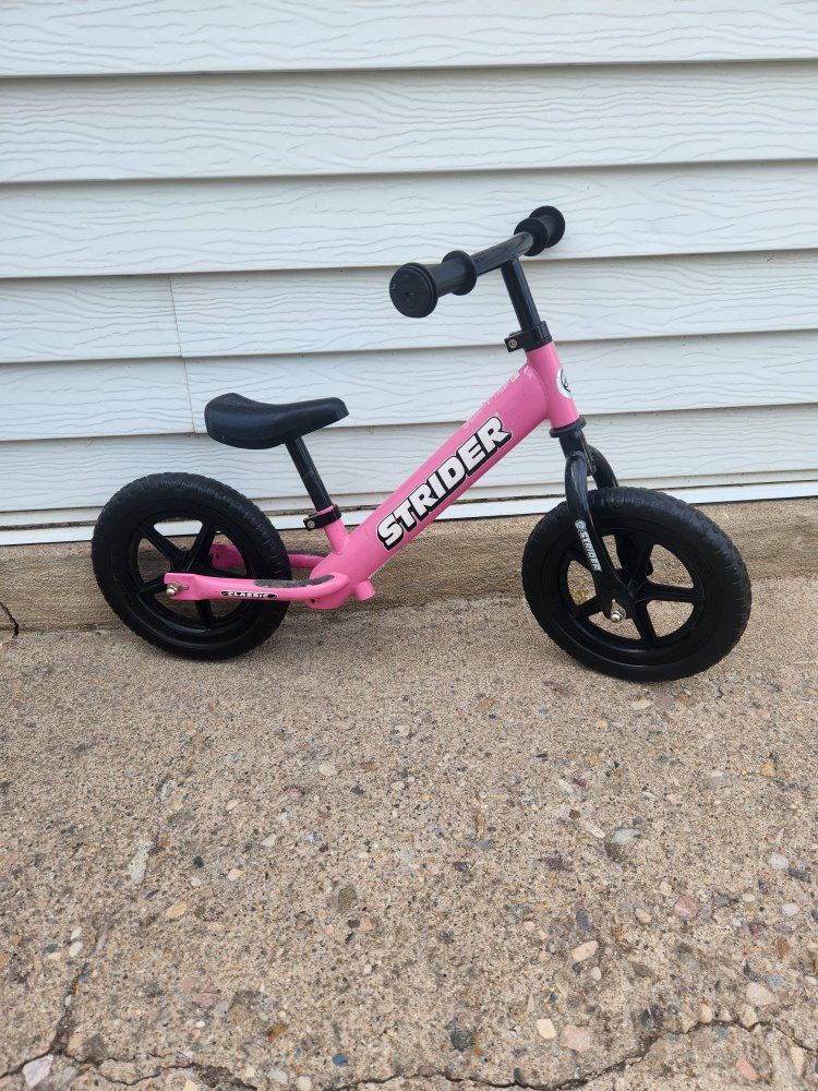 balance bike, strider,  pink, excellent condition 