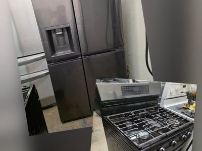 Black stainless refrigerator and gas range