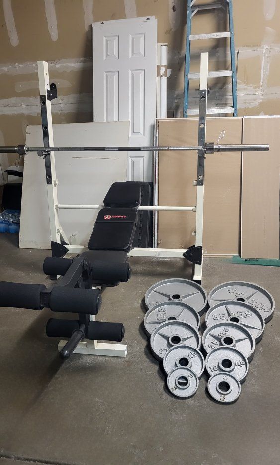 Bench and 235 pounds of weights