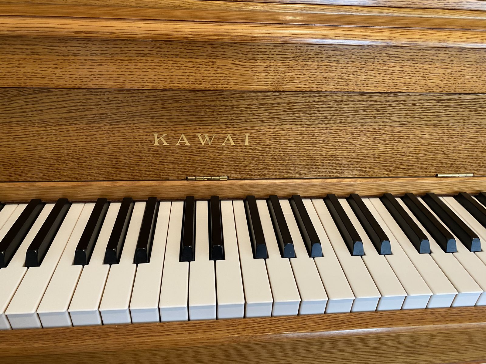 Kawai Console Piano in a Beautiful Satin Oak Finish