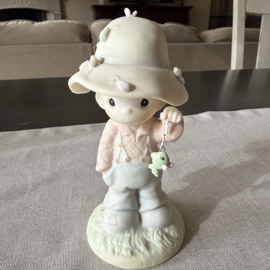 Precious Moments porcelain fisherman figurine titled "My Love Will Never Let You Go"