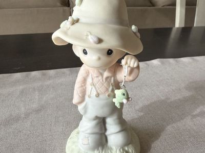 Precious Moments porcelain fisherman figurine titled "My Love Will Never Let You Go"