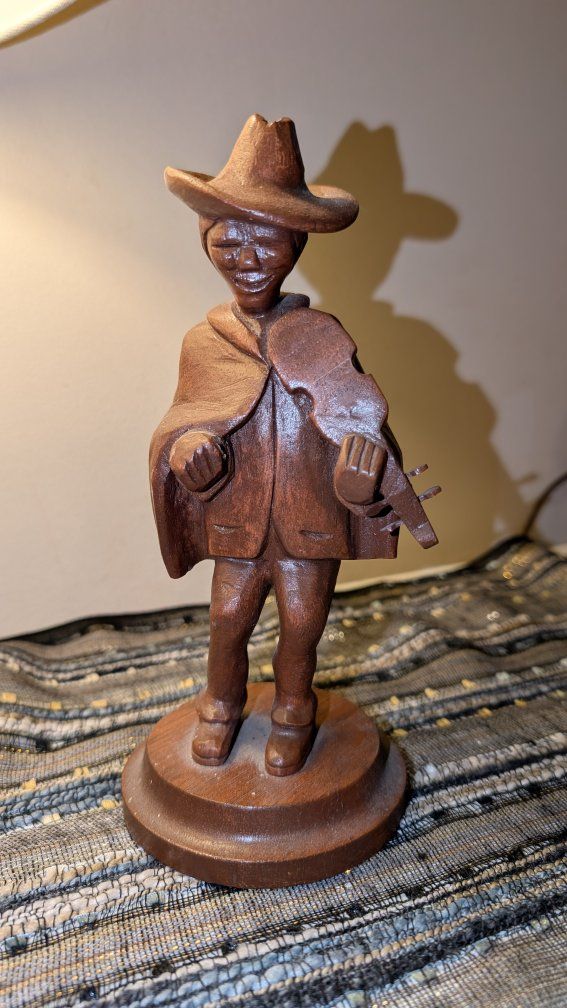 Vintage Handcarved violin player 

Made by great grandpa in the 1980s.